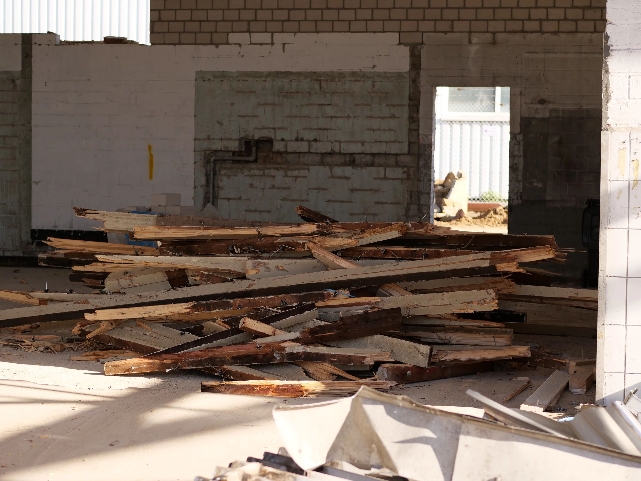 Construction debris piled inside a demolition site